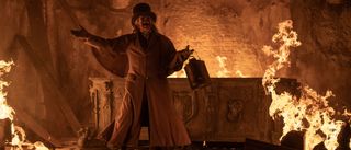 Willem Dafoe surrounded by flames in Nosferatu
